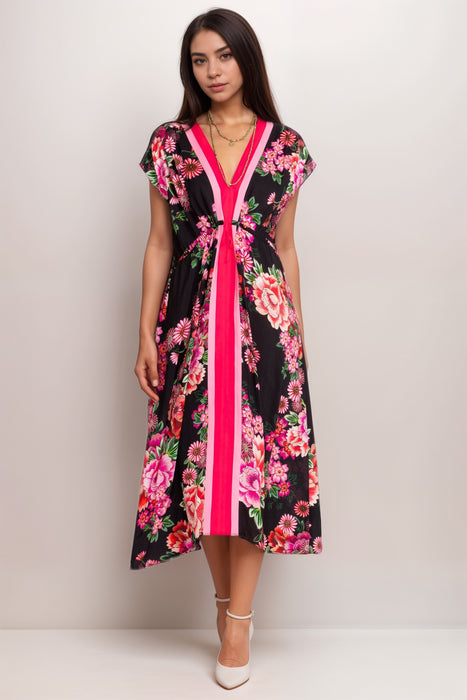 Woman wearing a black and pink floral midi kaftan dress with v-neck and drawstring waist from Johnny Was