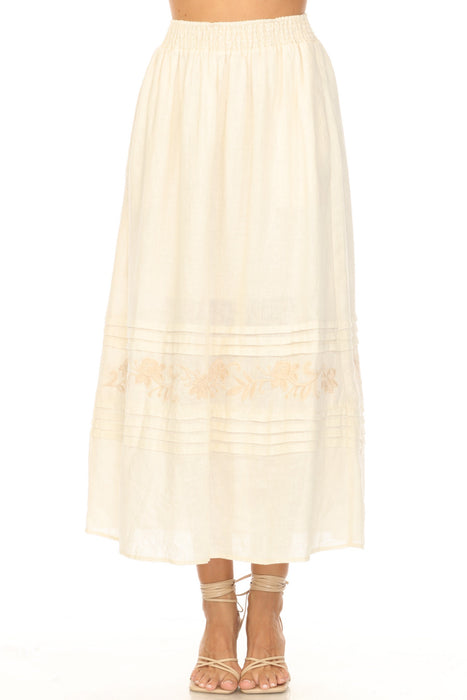 A beige smocked waist midi skirt with pleats and embroidery from Johnny Was