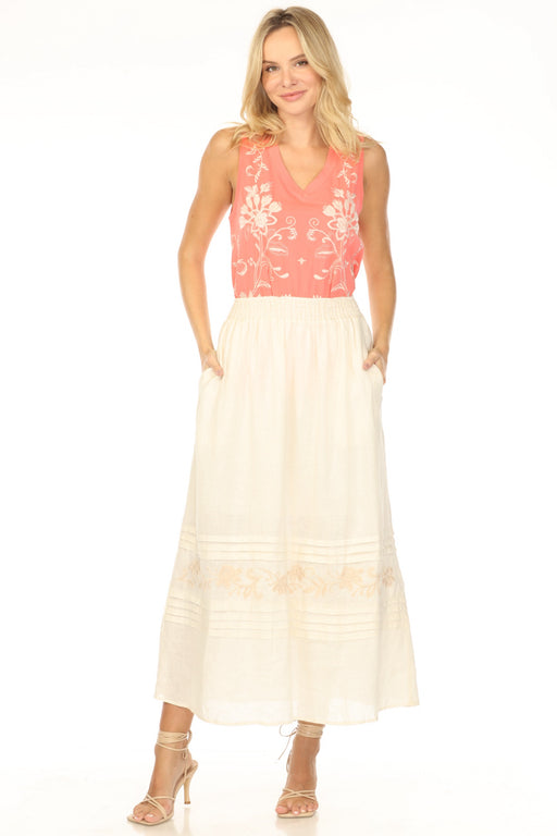 A beige smocked waist midi skirt with pleats, embroidery, and side pockets from Johnny Was