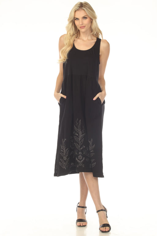 Woman wearing a black sleeveless midi dress with floral embroidery on the hem from Johnny Was