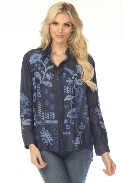 Woman wearing a dark blue embroidered shirt with button down front from Johnny Was
