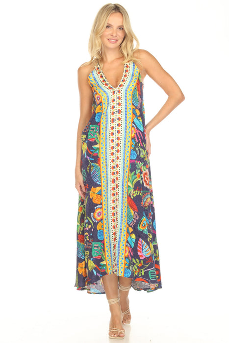 Woman wearing a colorful sleeveless maxi dress with a vibrant patterns and v-neck from Johnny Was