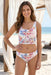 Woman wearing a colorful floral hipster bikini bottom with eyelet embroidery from Johnny Was