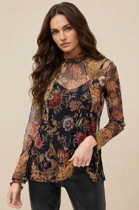 Woman wearing a long-sleeve floral mesh top with embroideries from Johnny Was
