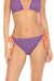 Purple bikini bottom with orange string ties and eyelets from Johnny Was