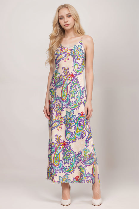 Woman wearing a colorful paisley patterned maxi slip dress from Johnny Was