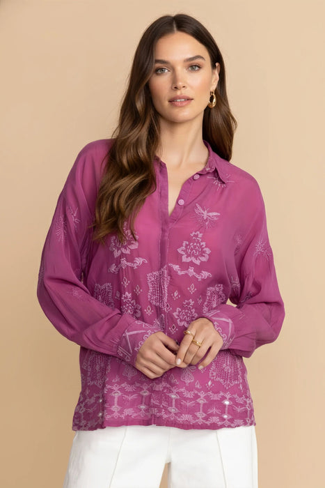 Woman wearing a purple embroidered button-down shirt with long sleeves from Johnny Was