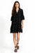 Woman wearing a black button front embroidered dress with scallop hem from Johnny Was