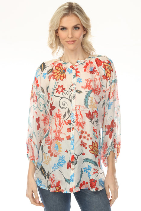 Woman wearing a colorful floral-printed silk tunic top with button front and 3/4 sleeves from Johnny Was