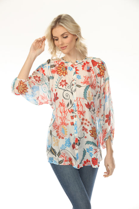 Woman wearing a colorful floral-printed silk tunic top with button front and 3/4 sleeves from Johnny Was