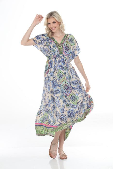 Woman wearing a floral v-neck maxi dress with smocked waist and side pockets from Johnny Was