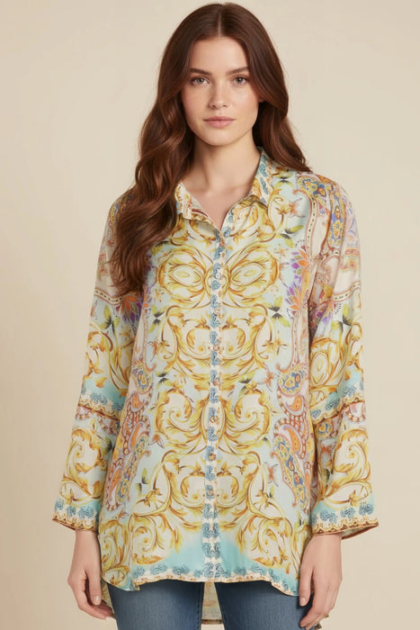 Woman wearing a colorful scroll scarf pattern with button front and long sleeves from Johnny Was
