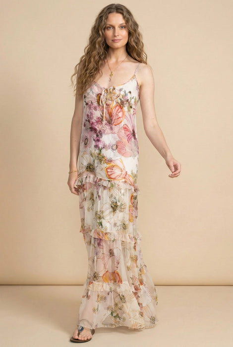 Woman wearing a floral maxi dress with tiered ruffle skirt and spaghetti straps from Johnny Was