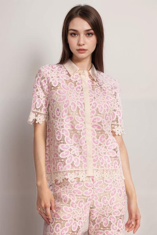 Woman wearing a pink crocheted shirt with scallop lace trim and button-down front from Johnny Was