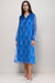 Woman wearing a blue lightweight silk midi dress with floral print