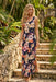 Woman wearing a sleeveless floral maxi dress with scoop neck from Johnny Was