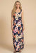Woman wearing a sleeveless floral maxi dress with scoop neck from Johnny Was