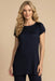 Woman wearing a dark blue pleated tunic top with short raglan sleeves from Johnny Was