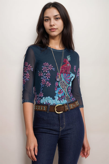 Woman wearing a navy mesh top with floral pattern and 3/4 sleeves from Johnny Was