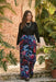 Woman wearing black paisley patterned mesh top with long sleeves from Johnny Was