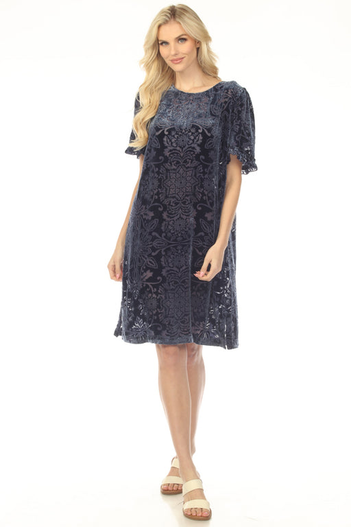 Woman wearing a navy mini shift dress with burnout velvet patterns from Johnny Was