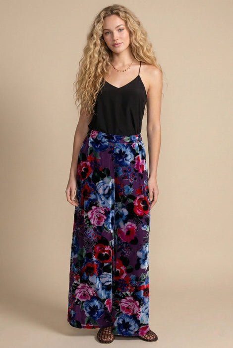 Woman wearing a floral-patterned wide leg pants from Johnny Was