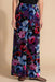 Woman wearing a floral-patterned wide leg pants from Johnny Was