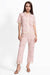 Woman wearing a pink crocheted cropped pant with scallop lace trim from Johnny Was