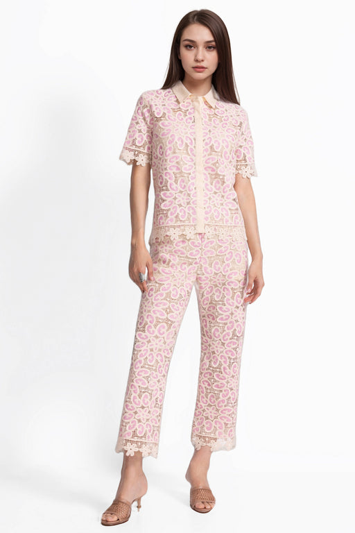 Woman wearing a pink crocheted cropped pant with scallop lace trim from Johnny Was