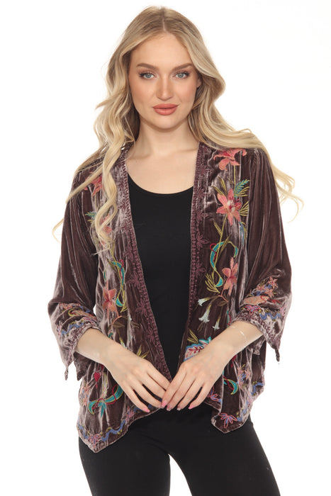 Woman wearing a velvet kimono with colorful floral embroideries and 3/4 sleeves