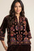 Woman wearing a leopard patterned 3/4 sleeve shirt with colorful embroideries from Johnny Was