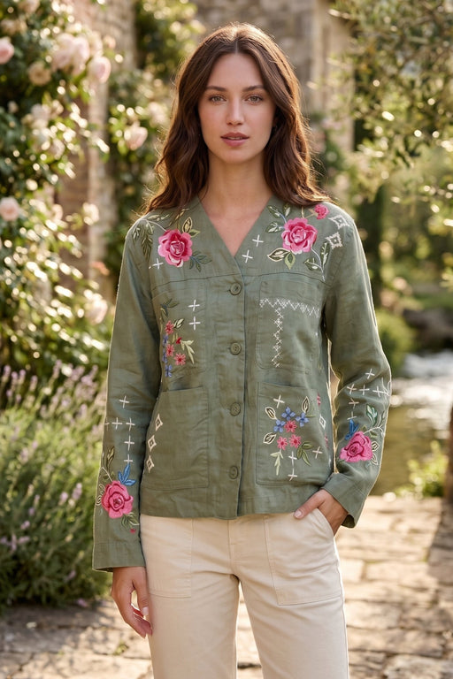 Woman wearing a green embroidered jacket with front pockets and long sleeves from Johnny Was