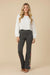 Woman wearing a gray flared high waist leggings with floral embroideries from Johnny Was