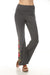 Woman wearing a gray flared high waist leggings with floral embroideries from Johnny Was
