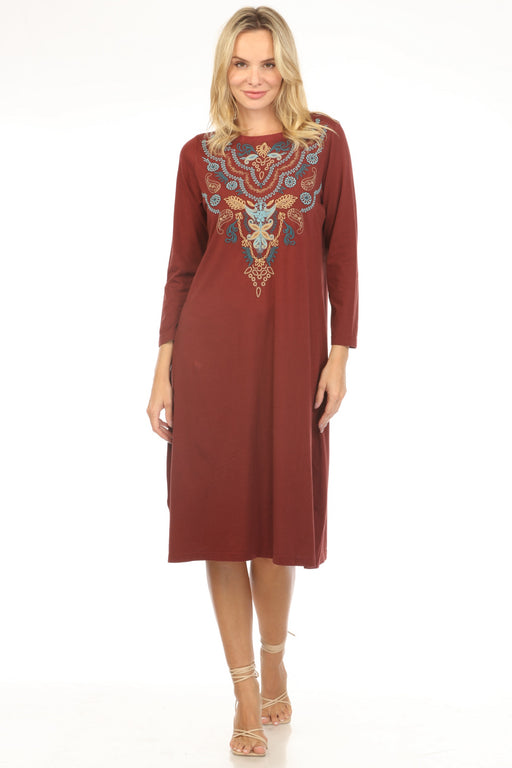 Woman wearing a chocolate brown dress with intricate embroidery and boat neck from Johnny Was