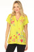 Woman wearing a citron tee with floral embroidery and buttoned v-neck from Johnny Was