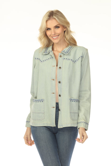 Woman wearing an embroidered denim jacket with button front and front pockets from Johnny Was