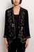 Woman wearing a black velvet bolero jacket with open front and embroidery from Johnny Was