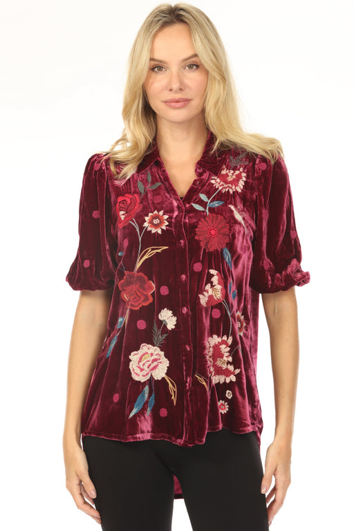 Woman wearing a red velvet shirt with puff sleeves and floral embroidery from Johnny Was