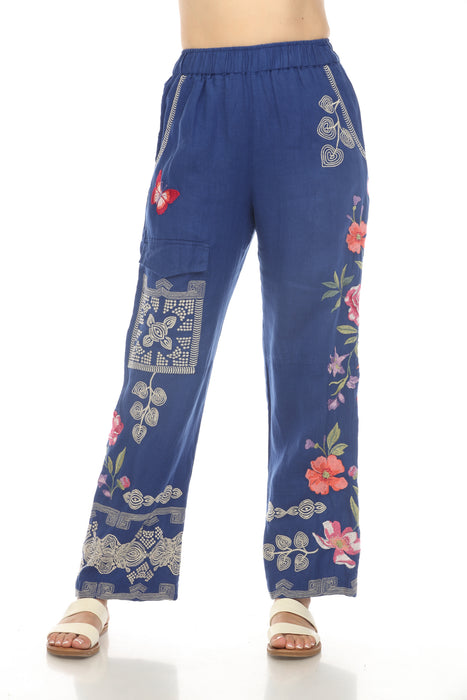 Woman wearing a blue floral embroidered wide leg cargo pants from Johnny Was