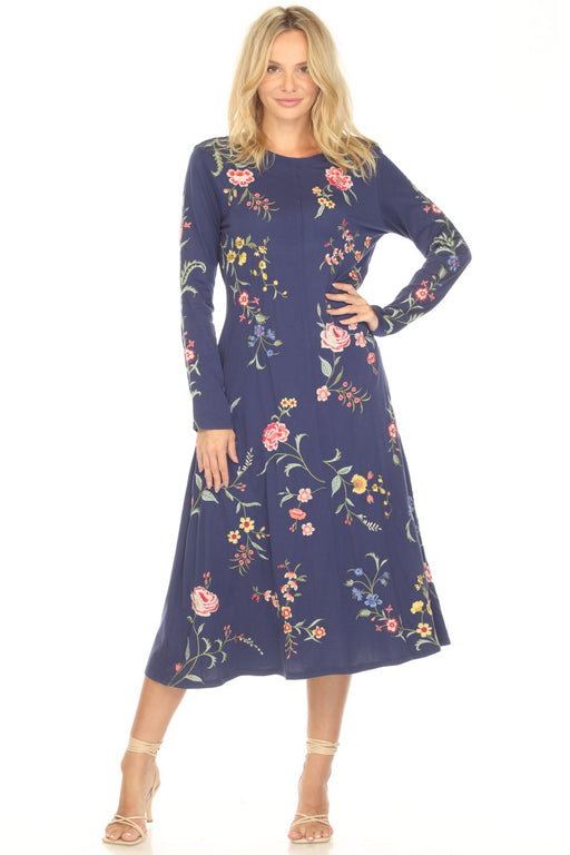 Woman wearing a navy dress with floral embroidery and crew neck from Johnny Was