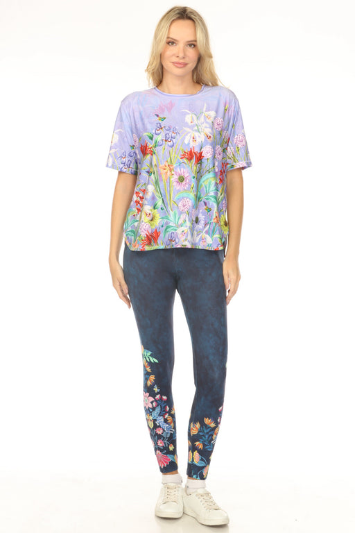Woman wearing a dark blue legging with colorful floral pattern from Johnny Was