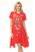 Woman wearing a red floral embroidered cotton dress with handkerchief hem from Johnny Was