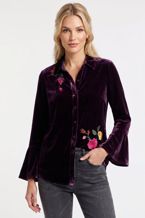 Woman wearing a purple velvet shirt with floral embroidery and flounce cuff sleeves from Johnny Was