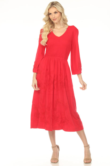 Woman wearing a red midi dress with v-neck and tiered skirt from Johnny Was