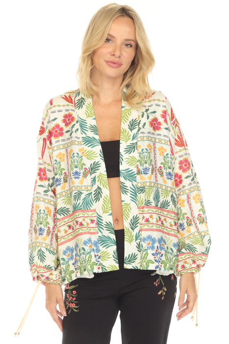 Woman wearing a colorful floral linen kimono jacket with tie cuff long sleeves from Johnny Was