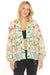 Woman wearing a colorful floral linen kimono jacket with tie cuff long sleeves from Johnny Was