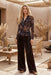 Woman wearing brown velvet wide leg pants with leopard pattern and side pockets from Johnny Was