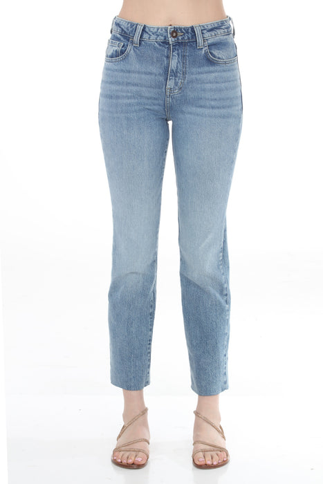 Woman wearing a blue rinse wash jeans with crop straight leg from Johnny Was