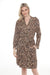 Woman wearing a leopard print sleep robe with waist tie and side pockets from Johnny Was